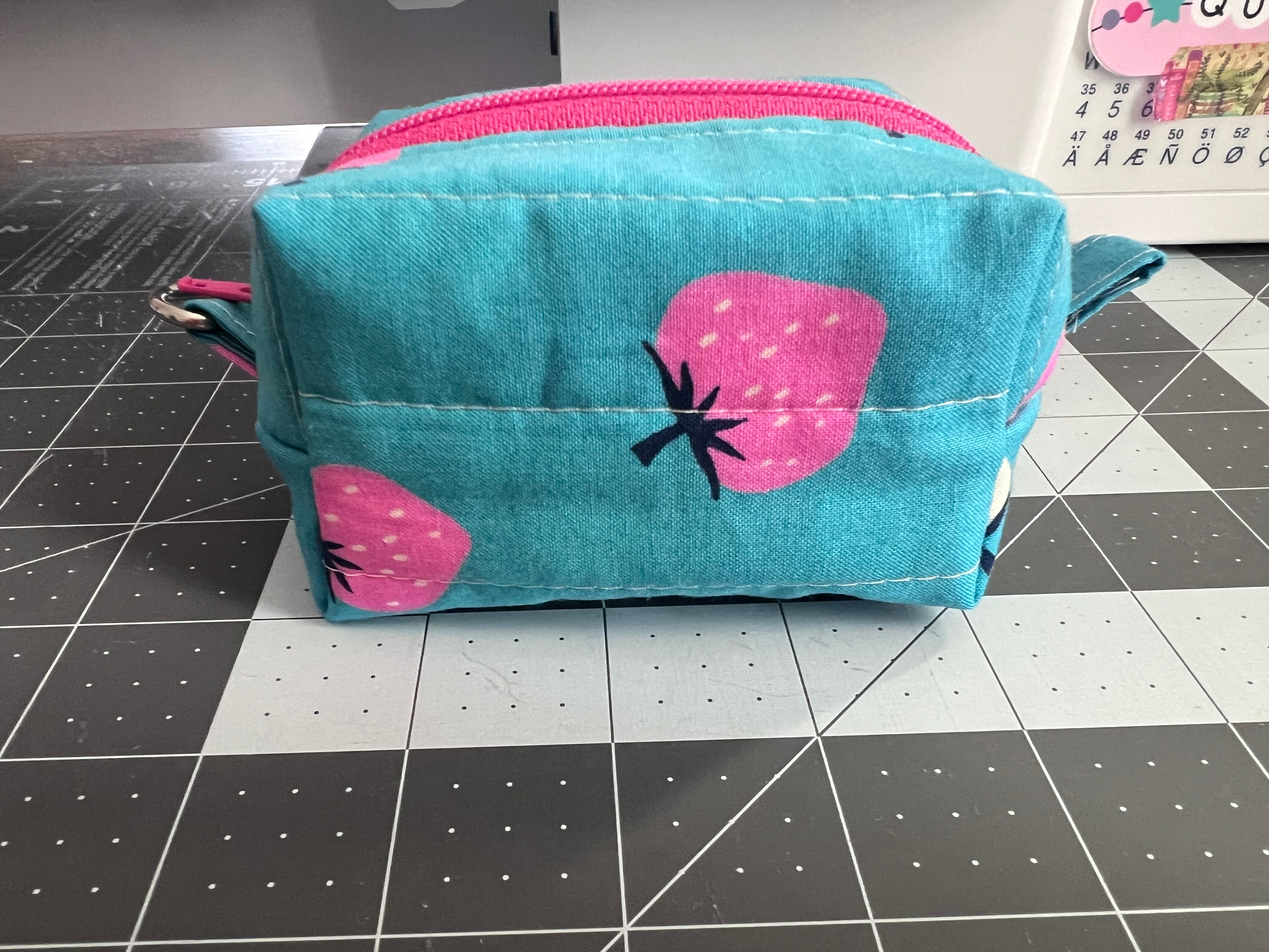 Quilted lite blue strawberry mini boxy pouch